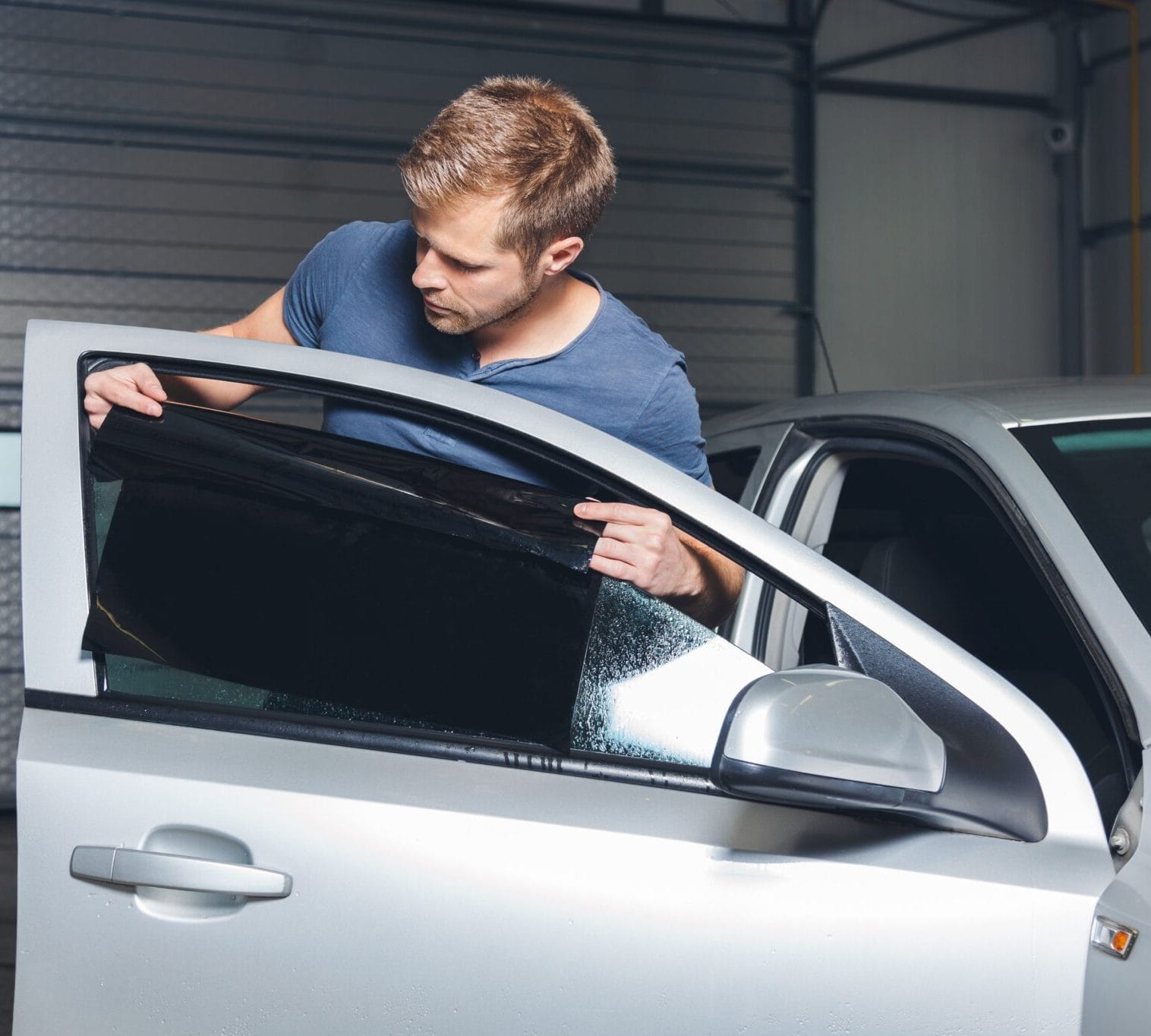 Skilled Technician Applying Tint Film